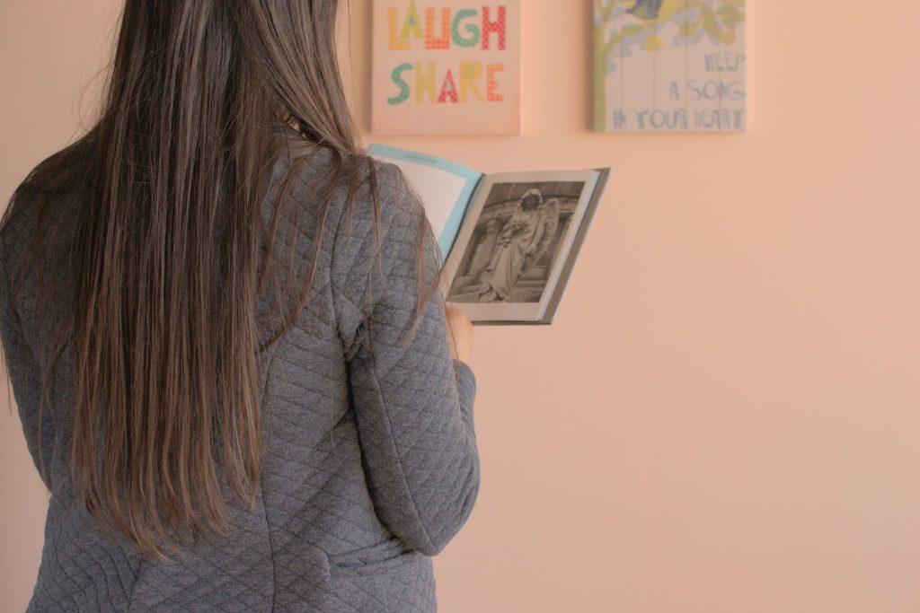 Giselle is reading her own photo book.
